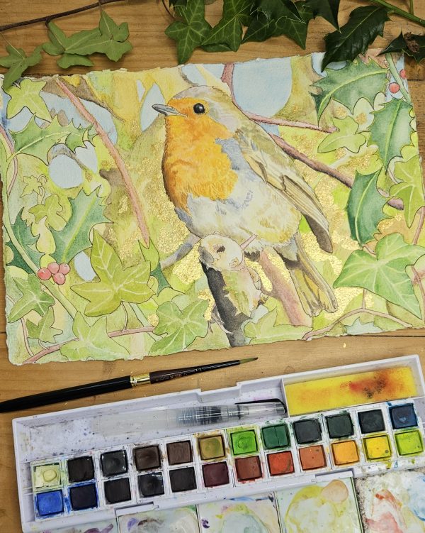Painting the robin among the holly and ivy